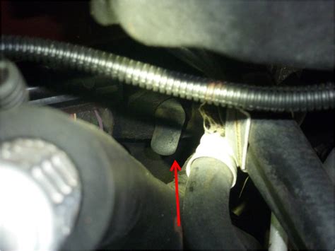 You should see the AC hoses going into the firewall and the heater hoses. . 2021 tahoe ac drain location